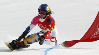 In this file photo, Julie Pomagalski from France speeds down the course 23 February, 2006 during the Turin 2006 Winter Olympics Ladies' Parallel Giant Slalom in Bardonecchia, Italy.