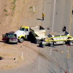 Authorities respond to the scene of a deadly crash involving an SUV and a big rig in Imperial County on Tuesday, March 2, 2021.