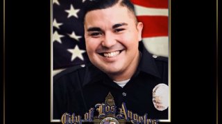 Police lead a procession on Wednesday, March 3, 2021 for an officer who died after being struck by a vehicle in the Newton Division area.