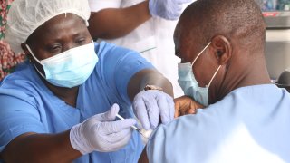 A person receives a dose of the Oxford/AstraZeneca coronavirus disease vaccine at the Cacovid isolation centre, Mainland, Infectious disease hospital, Yaba, in Lagos, Nigeria.