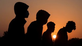 File photo: Unaccompanied minor migrants wait to be transported by the U.S. Border Patrols after crossing the Rio Grande River into the United States from Mexico in La Joya, Texas, April 7, 2021.