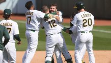 Mitch Moreland of the Oakland Athletics and teammates celebrate.
