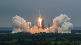 In this April 29, 2021, file photo released by China's Xinhua News Agency, a Long March 5B rocket carrying a module for a Chinese space station lifts off from the Wenchang Spacecraft Launch Site in Wenchang in southern China's Hainan Province.