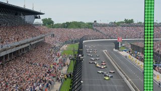 INDIANAPOLIS, IN - MAY 26: IndyCar driver Simon Pagenaud (22) of the Menards Team Penske Chevrolet leads the field tot he green flag for the start of the NTT IndyCar Series 103rd running of the Indianapolis 500 on May 26, 2019, at the Indianapolis Motor Speedway in Indianapolis, Indiana.