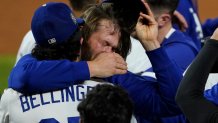 ARLINGTON, TX - OCTOBER 27: Clayton Kershaw #22 of the Los Angeles Dodgers celebrates with Cody Bellinger #35 after defeating the Tampa Bay Rays 3-1 in Game Six to win the 2020 MLB World Series at Globe Life Field on Tuesday, October 27, 2020 in Arlington, Texas. (Photo by Cooper Neill/MLB Photos via Getty Images)