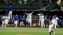 ARLINGTON, TEXAS - OCTOBER 27: The Los Angeles Dodgers celebrate after Julio Urias #7 strikes out Willy Adames (not pictured) of the Tampa Bay Rays to give the Dodgers the 3-1 victory in Game Six to win the 2020 MLB World Series at Globe Life Field on October 27, 2020 in Arlington, Texas. (Photo by Tom Pennington/Getty Images)