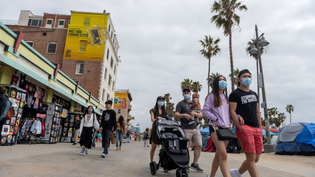 Credit: NBC Los Angeles (Photo by Alexi Rosenfeld/Getty Images). April 23, 2021. People wearing masks walk along Venice Beach amid the coronavirus pandemic. Accessed December 5, 2022.