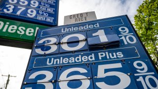 A sign announces the days gas prices at a station in Annapolis, Maryland, on May 12, 2021.