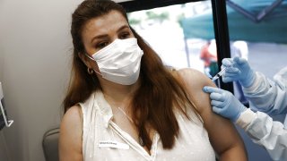 Erica Aparitio receives a Johnson & Johnson COVID-19 vaccine from Yelany Lima, a Registered Nurse, at the UHealth’s pediatric mobile clinic on May 17, 2021 in Miami, Florida.