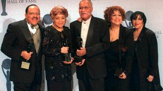 CORRECTS SINGING GROUP TO THE STAPLE SINGERS - FILE - This March 15, 1999 file photo shows the sibling group The Staple Singers, from left, Pervis, Cleotha, Pops, Mavis, and Yvonne at the Rock and Roll Hall of Fame induction ceremony in New York. Yvonne Staples, whose voice and business acumen powered the success of her family's Staples Singers gospel group, has died at age 80. The Chicago funeral home Leak and Sons says that she died Tuesday, April 10, 2018 at home in Chicago.