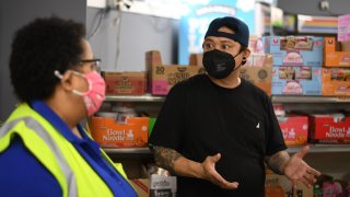 joe Chau, right, owner of Menicks Market