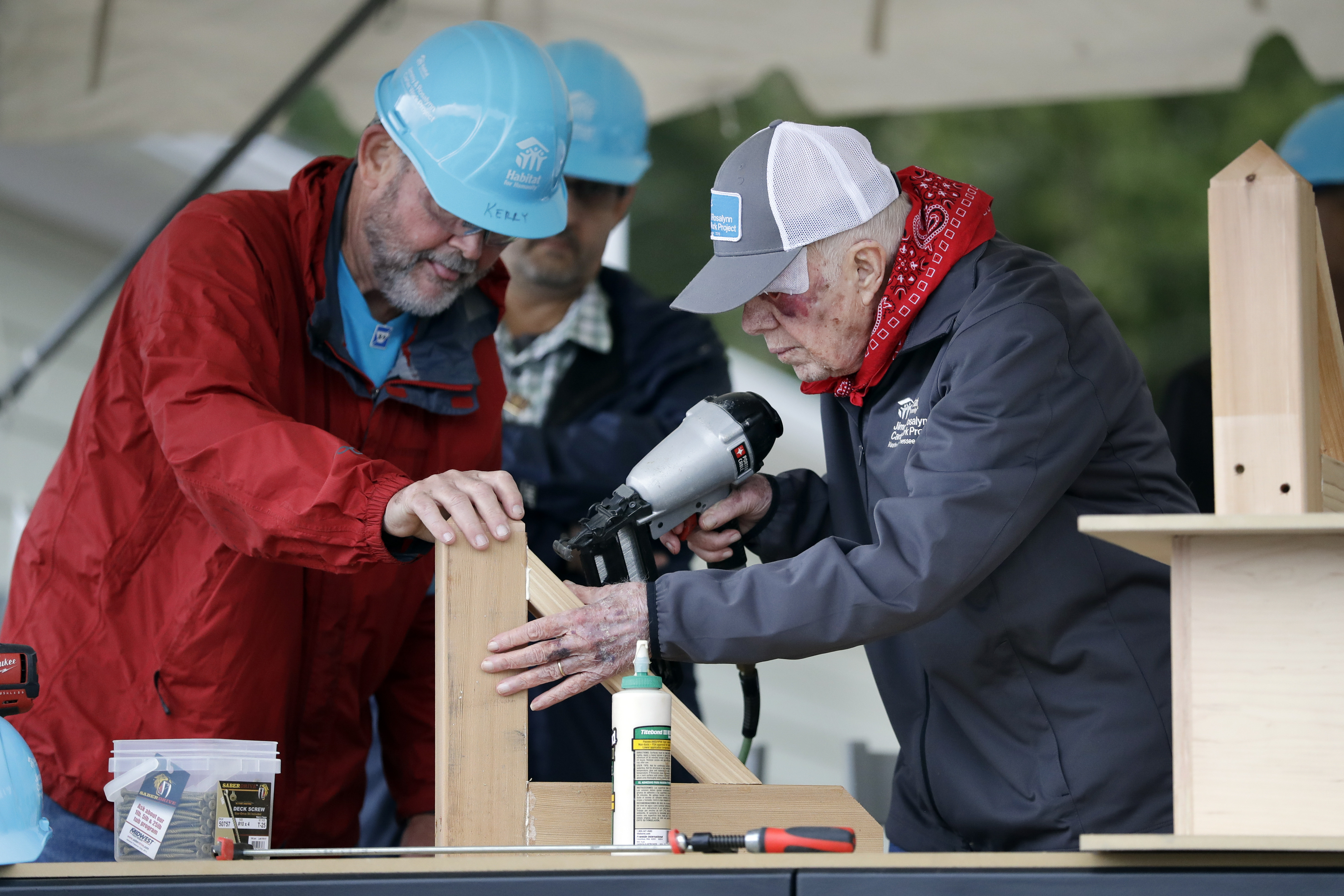 Former President Jimmy Carter, right, works at a Habitat for Humanity building project Monday, Oct. 7, 2019, in Nashville, Tenn. Carter wears a bandage after a fall the day before at his home in Plains, Georgia.