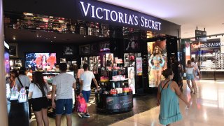 People walk past a Victoria’s Secret store in Barcelona.