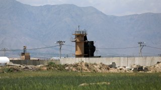 A wall surrounds Bagram Air Base northwest of the capital Kabul, Afghanistan, Monday, May 3, 2021. As US troops pack up to leave Afghanistan after nearly 20 years of war, the Americans are dismantling their portion of Bagram, their largest remaining outpost in Afghanistan, and anything that they are not taking home or giving to the Afghan military, they destroy as completely as possible.