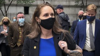 Natalie Mayflower Sours Edwards, center, leaves court after receiving a six-month prison sentence for leaking confidential financial reports to a journalist at Buzzfeed, Thursday June 3, 2021, in New York.