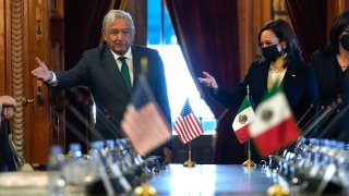 Vice President Kamala Harris and Mexican President Andres Manuel Lopez Obrador gesture as they arrive for a bilateral meeting Tuesday, June 8, 2021, at the National Palace in Mexico City.
