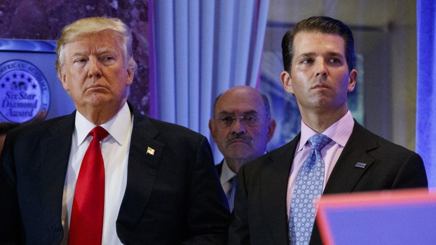 In this Jan. 11, 2017, shows President-elect Donald Trump, left, his chief financial officer Allen Weisselberg, center, and his son Donald Trump Jr., right, attend a news conference in the lobby of Trump Tower in New York.