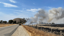 By 4:55 p.m., the Stowe fire burned 122 acres, and the forward rate of spread had been stopped by firefighters.