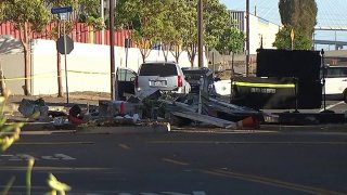A crumpled guard shack at the scene of a hit-and-run crash in Long Beach.