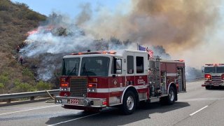 Brush burns along Highway 73 in Orange County.