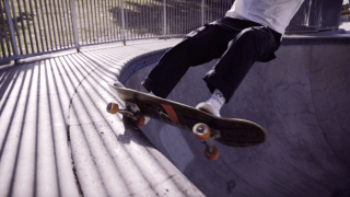 person on skateboard in skate park