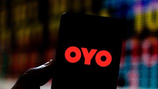 An OYO Rooms logo seen displayed on a smartphone.