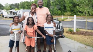 Karen and Sylvester Akpan with their son, Aiden (L), niece, Avery, and nephew, Ethan.