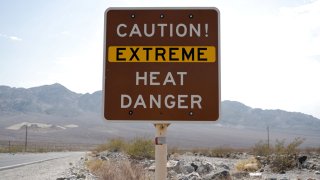 A sign warns of extreme heat in Death Valley, California, U.S., July 11, 2021.