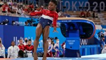 Simone Biles lands from the vault