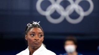 Simone Biles looks to the side