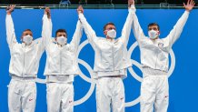 United States men's 4x100m freestyle relay team of Caeleb Dressel, Blake Pieroni, Bowen Beck and Zach Apple, celebrate on the podium after winning the gold medal at the 2020 Summer Olympics, Monday, July 26, 2021, in Tokyo, Japan.