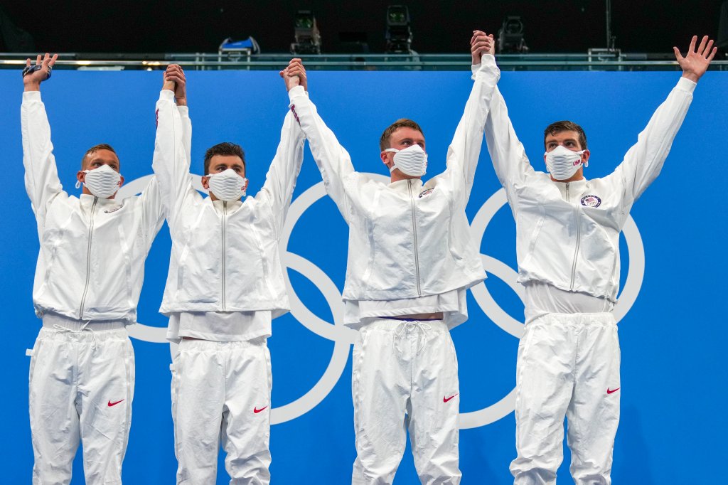 United States men's 4x100m freestyle relay team of Caeleb Dressel, Blake Pieroni, Bowen Beck and Zach Apple, celebrate on the podium after winning the gold medal at the 2020 Summer Olympics, Monday, July 26, 2021, in Tokyo, Japan.