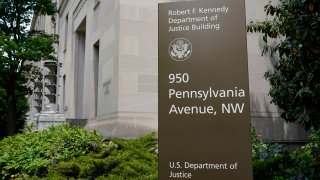 a sign outside the Robert F. Kennedy Department of Justice building in Washington