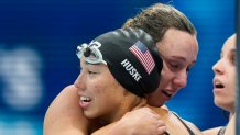 Torri Huske, of United States, embraces teammates after winning the silver medal in the women's 4x100-meter medley relay final at the 2020 Summer Olympics, Sunday, Aug. 1, 2021, in Tokyo, Japan.