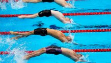 Swimmers start in the men's 4x100-meter medley relay final at the 2020 Summer Olympics, Sunday, Aug. 1, 2021, in Tokyo, Japan.