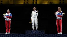 From left: Silver medalist Inna Deriglazova of Team ROC, gold medalist Lee Kiefer of Team United States and bronze medalist Larisa Korobeynikova of Team ROC pose on the podium during the medal ceremony for the Women's Foil Individual Fencing Gold Medal event on day two of the Tokyo 2020 Olympic Games at Makuhari Messe Hall on July 25, 2021, in Chiba, Japan.