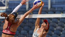 Kelly Claes #1 of Team United States attempts to block the hit by Heather Bansley #1 of Team Canada during the Women's Round of 16 beach volleyball on day nine of the Tokyo 2020 Olympic Games at Shiokaze Park on August 1, 2021, in Tokyo, Japan.