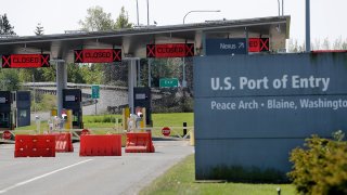 FILE - The Peace Arch border crossing into the U.S. from Canada, May 7, 2020, in Blaine, Wash.