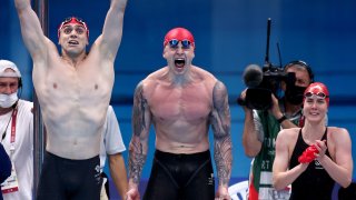 James Guy, Adam Peaty, Kathleen Dawson and Anna Hopkin of Great Britain react during the Mixed 4 x 100m Medley Relay Final