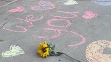 Messages in honor of Rylee Goodrich, 19, and Anthony Barajas, 18, were left outside a movie theater at The Crossings mall in Corona.