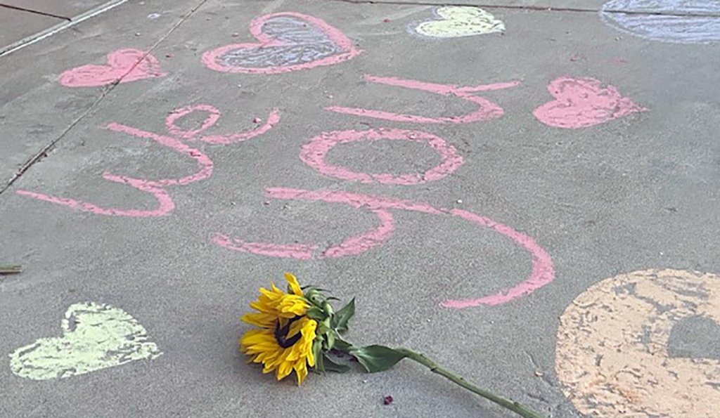 Messages in honor of Rylee Goodrich, 19, and Anthony Barajas, 18, were left outside a movie theater at The Crossings mall in Corona.