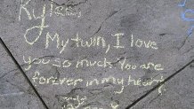 Messages in honor of Rylee Goodrich, 19, and Anthony Barajas, 18, were left outside a movie theater at The Crossings mall in Corona.