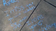 Messages in honor of Rylee Goodrich, 19, and Anthony Barajas, 18, were left outside a movie theater at The Crossings mall in Corona.