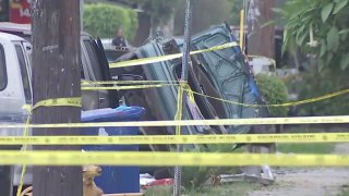 Cars, buildings and an LAPD bomb squad truck were damaged in an explosion during an illegal fireworks bust in a South LA neighborhood Wednesday June 30, 2021.