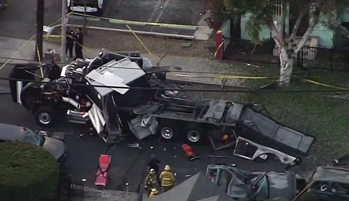 Cars, buildings and an LAPD bomb squad truck were damaged in an explosion during an illegal fireworks bust in a South LA neighborhood Wednesday June 30, 2021.