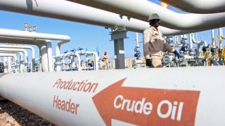 People work at the Halfaya oilfield in Amara, southeast of Baghdad.