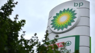 BP logos are seen at a BP petrol and diesel filling station southeast of London on June 15, 2020.