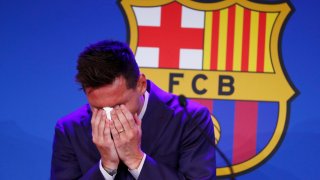 Lionel Messi cries at the start of a press conference