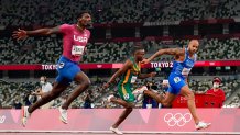 Lamont Jacobs of Italy, right, wins the men's the 100-meter final at the Tokyo Olympics, Sunday, Aug. 1, 2021, in Tokyo. Team USA's Fred Kerley, left, took home silver for the event.
