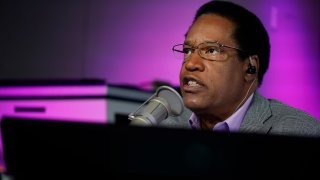 FILE — In this July 12, 2021 file photo radio talk show host Larry Elder speaks during his show, in Burbank, Calif.